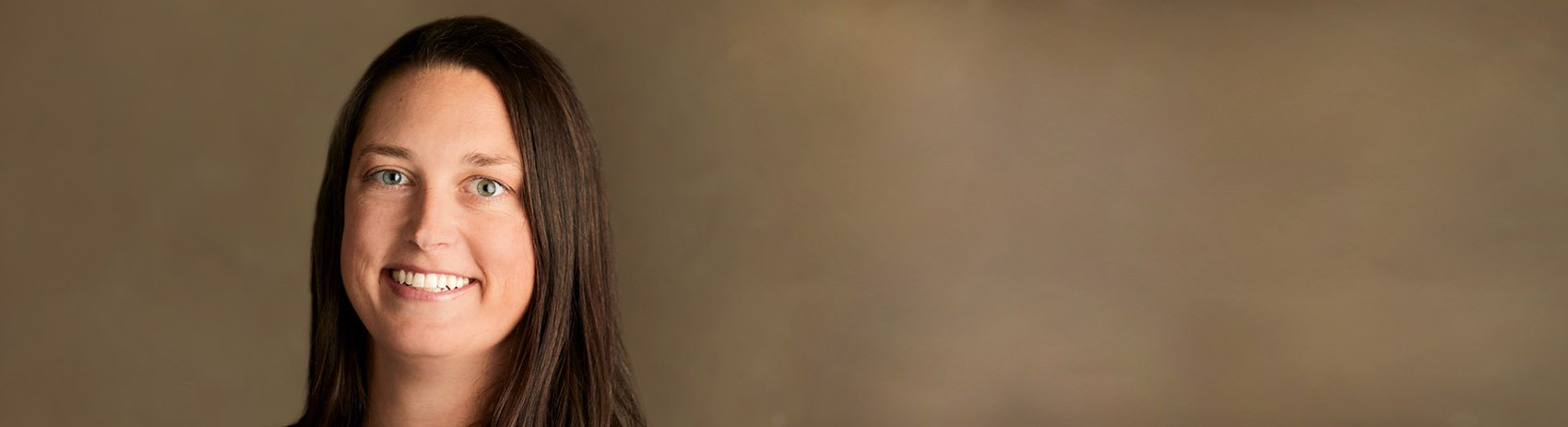 woman looking at camera and smiling